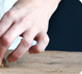 a hand cutting salad
