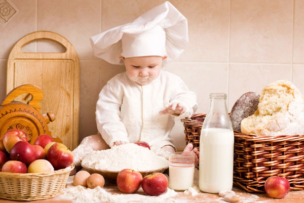 Cute Chef (Kid) playing with flour